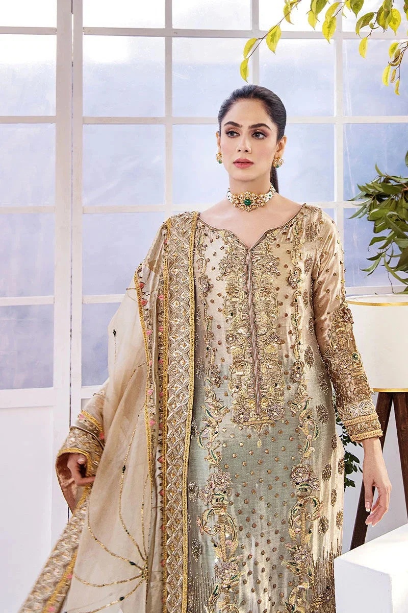 Noor- e- Samar pakistani fashion outfit in gold, green tones.